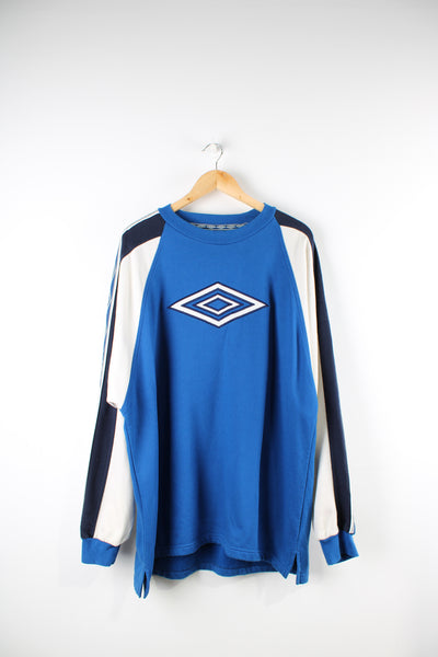Vintage 90's Umbro bright blue sweatshirt, features embroidered logo on the front and branded ribbon down both sleeves 