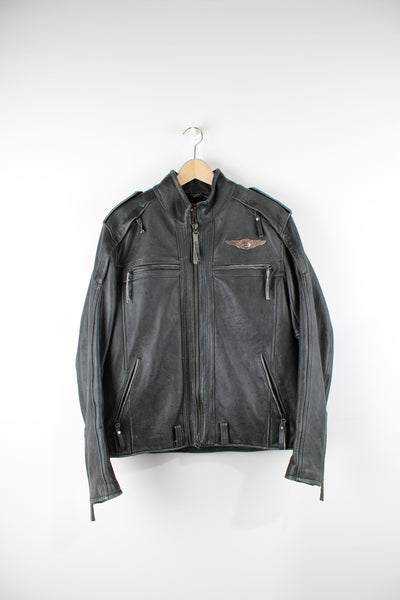 Vintage Harley Davidson 100th anniversary motorcycle leather jacket in black, zip up with multiple pockets, adjustable waist belt, airplane zips, and has metal logo the chest and back of the jacket.   good condition - some wear to the leather in places, missing waist belt.   Size in Label:  Mens XL - Measures more like a L