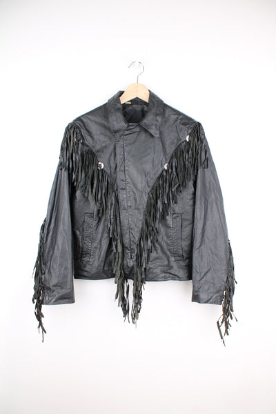 Vintage Wilson's black zip through leather jacket with fringe details on the back of the shoulders and silver conch buttons 