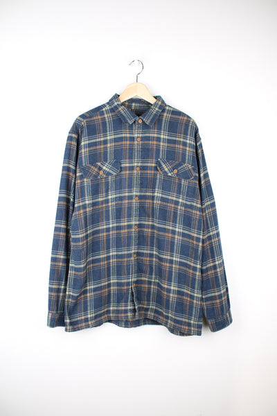 Patagonia Flannel Shirt in a blue, green and brown colourway, button up, chest pockets, and has the logo embroidered on the side.