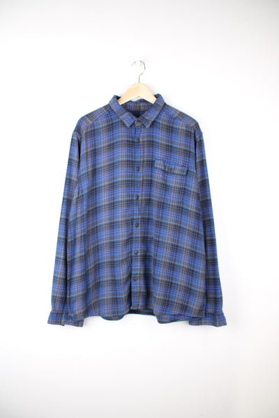Patagonia Flannel Shirt in a blue and brown colourway, button up, chest pocket, and has the logo embroidered on the side.