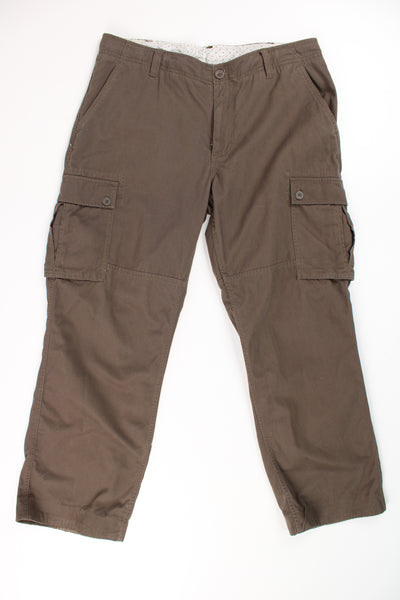 The North Face khaki green cargo style trousers with chunky pockets and embroidered logo on the waistband