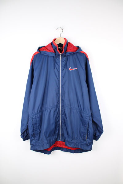 90's red and blue Nike zip through lightweight coat, features embroidered logo on the chest and back of the jacket.