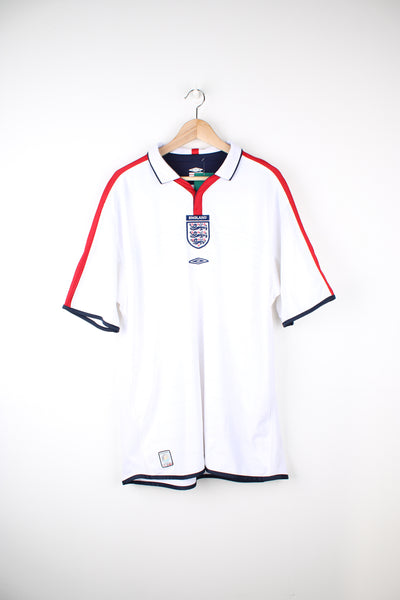 Vintage England 2003/05, Umbro Home Football Shirt, white, blue and red colourway with reversible option, button up with a collar and has embroidered logos on the front.