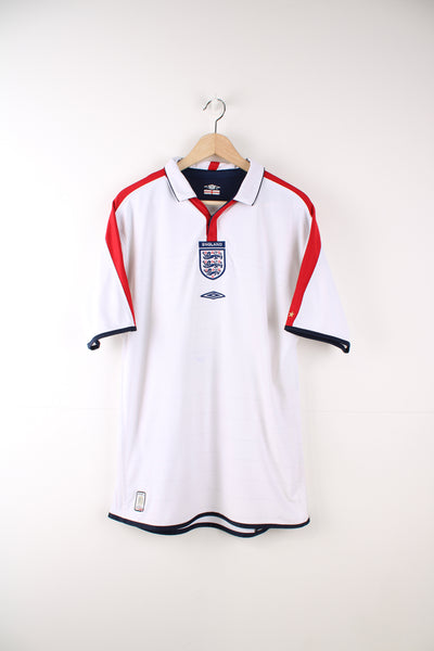 Vintage England, Umbro 2003/05 Reversible Football Kit in white and red or white and blue colourways, button up v neck collar, and has the logos embroidered on the front.