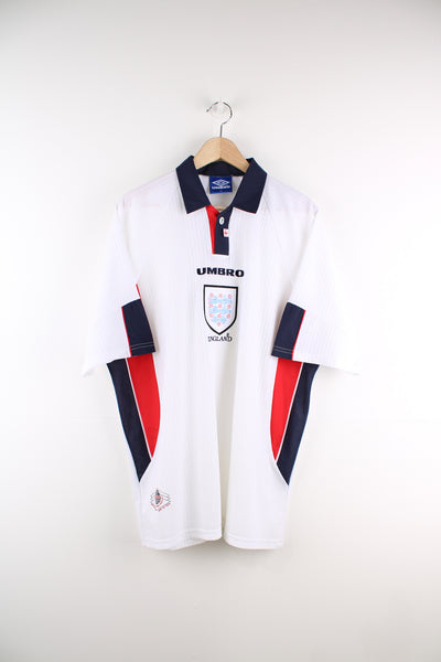 Vintage England, Umbro 1997/99 Football Shirt in a white, red and blue colourway, button up v neck collar, and has the logos embroidered on the front.