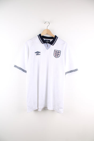 Vintage England, Umbro 1990/92 Football Shirt in a white and blue colourway, number 19 Gascoigne printed on the back, button up v neck collar, and has the logos embroidered on the front.