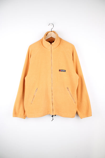 Berghaus Fleece in a yellow colourway, zip up, pockets and has the logo embroidered on the front.