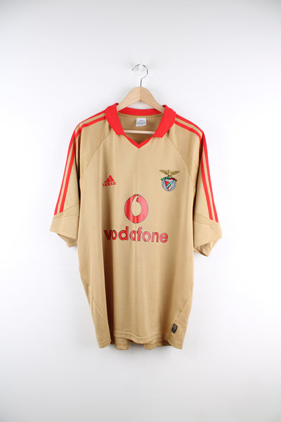 Benfica 2004/05 Adidas Football Shirt in a gold and red colourway, v neck with a collar, and has the logos printed on the front and back.