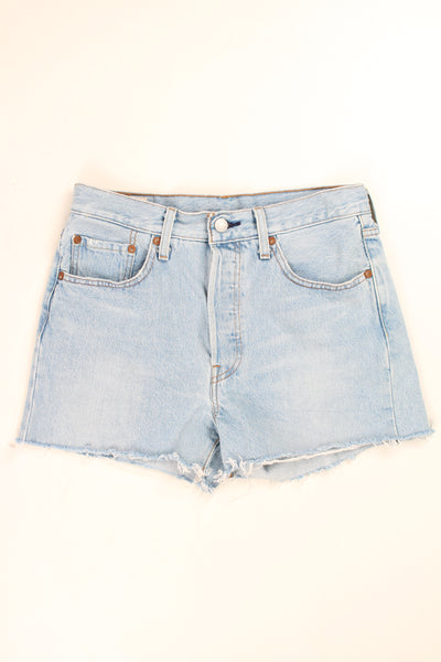 Vintage Levi's 501 blue distressed denim cut off shorts with frayed edges