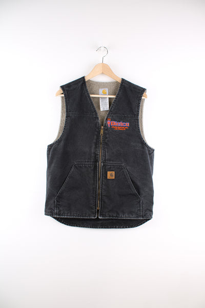 Carhartt Gilet in a faded black colourway, v neck, zip up with side pockets, sherpa lining and has the logo embroidered on the front alongside 'Dielco Crane Services, Las Vegas' company spell out.
