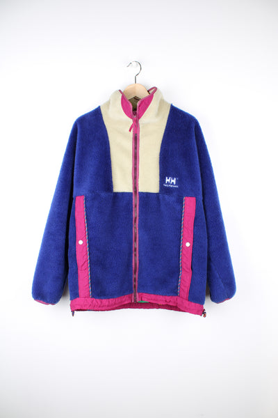 90's Helly Hansen Fleece in a blue, purple and white colourway, zip up, adjustable waist, big side pockets, and has logo embroidered on the front.
