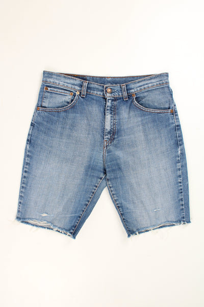 Levi's 525 blue denim jorts with embroidered details on the back pockets and frayed legs