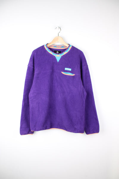 Columbia Wapitoo Fleece in a purple colourway, patterned collar, sweatshirt with chest pocket, and has the logo embroidered on the front.