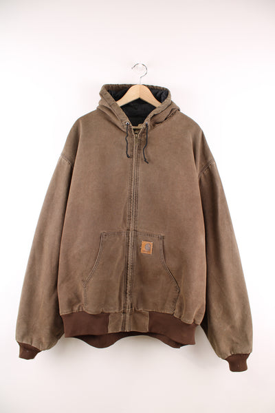 Carhartt Active Jacket in a brown colourway, zip up with a hood, side pockets, and has the logo embroidered on the front.