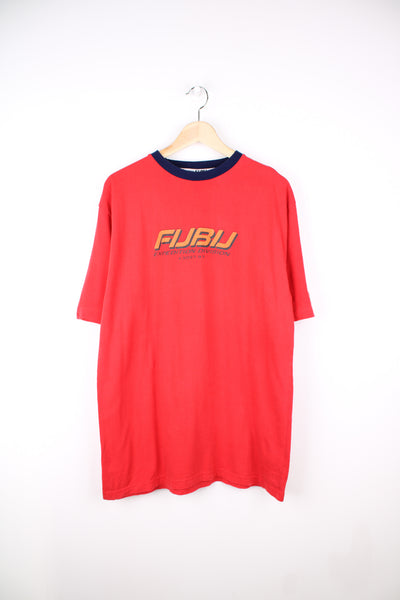 Vintage FUBU red t-shirt with printed spell-out across the front and design on the back. ALso features plastic branded patch on the arm.  good condition Size in Label: Mens L Our Measurements: Chest: 23 inchesLength: 30 inches