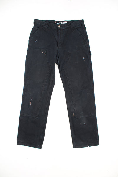 Carhartt all black double knee carpenter jeans with multiple pockets and signature logo on the back pocket 