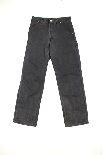 Carhartt all black carpenter jeans with multiple pockets and signature logo on the back pocket  