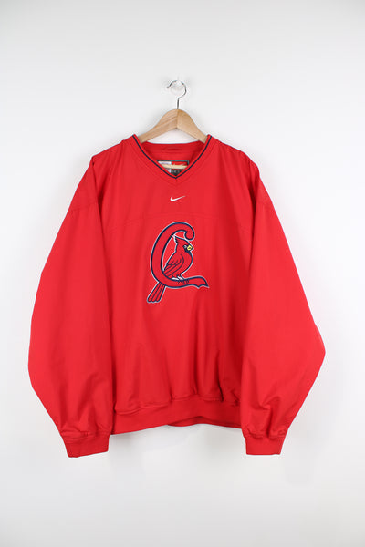 Vintage St Louis all red training top/pullover by Nike. Features large embroidered Cardinal's logo on the front and pockets 