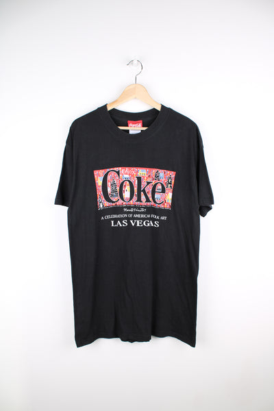 Vintage 90's Coca - Cola black t-shirt with printed Howard Finster "American Folk Art Las Vegas" graphic on the front good condition Size in Label:  Mens L