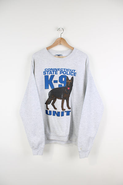  Vintage 90's Connecticut State police K9 unit grey crews neck sweatshirt, with printed spell-out graphic on the front, by Lee