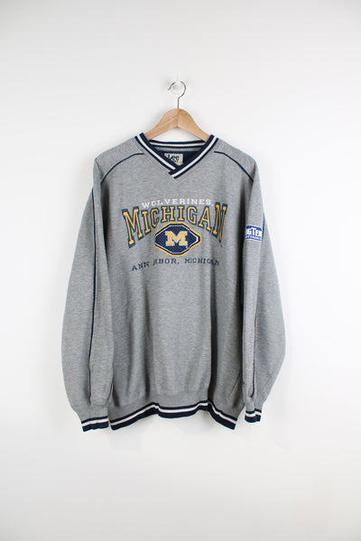Vintage Lee Sport Michigan Wolverines grey v-neck sweatshirt, features embroidered spell-out logo across the chest 