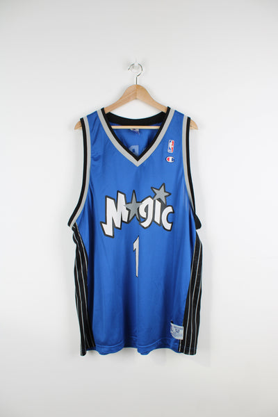 Tracy McGrady Orlando Magic basketball jersey by Champion, features embroidered Champion logo on the chest and spell-out details on the front and back  