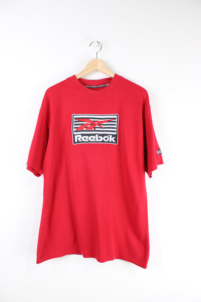 Vintage 90's Reebok red T-shirt with embroidered spell-out Reebok across the front. 