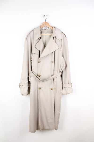Vintage Yves Saint Laurent tan button up trench coat, features branded lining and belt 