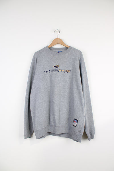 Vintage St. Louis Rams grey crewneck sweatshirt by NFL, features embroiered team logo on the chest.  good condition - faint mark on the front by the hem (see photos) Size in Label: Mens XL 