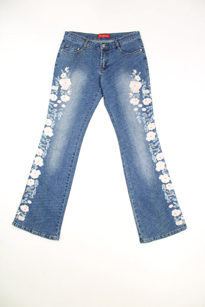 Tenghong Y2K Floral Flared Jeans in a blue colourway, low rise, multiple pockets and has floral patterns going down the side of the legs embroidered with beads.