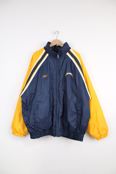 Vintage NFL Los Angeles Chargers blue and yellow sports coat/ bomber jacket. Features embroidered  Los Angeles Chargers on the chest and across the back. Good Condition - faint marks on the cuffs Size in Label: Mens XXL
