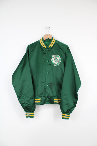 Boston Celtics, NBA Chalk Line Varsity Jacket in a green, white and yellow team colourway, satin material, button up, and has the logo embroidered on the chest.