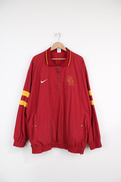 University Southern California Trojans, Nike Training Jacket in the red and yellow team colourway, quarter zip, big pouch pocket, and has logos embroidered on the front and back.