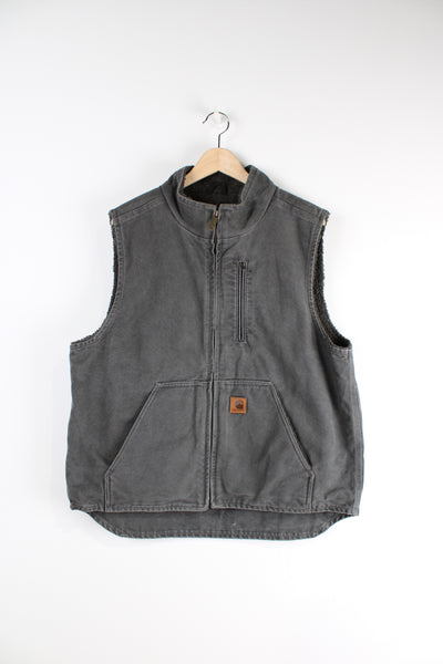 Vintage Carhartt grey workwear gilet with sherpa lining, multiple pockets and branded logo.