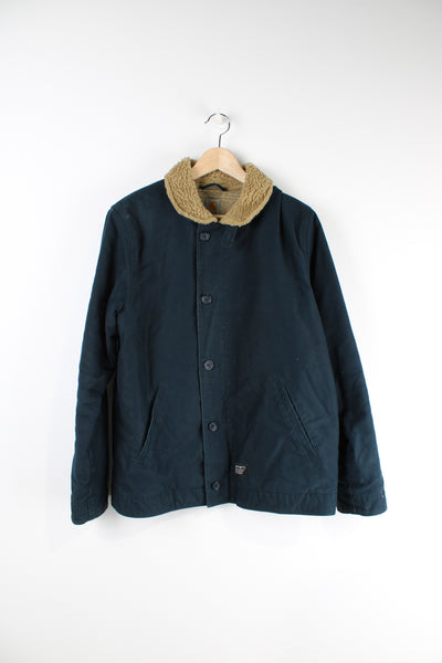 Vintage Carhartt workwear jacket with tan sherpa collar and lining inside. Button and zip up jacket.