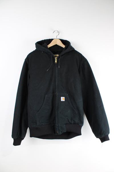 Vintage Carhartt black active jacket with heavy cotton lining, hood and Carhartt logo on the pocket.