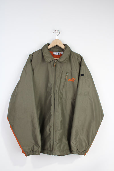 Puma khaki green zip through coat with orange embroidered logo on the chest