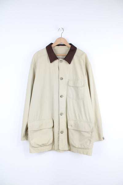 Vintage light tan cotton chore jacket by Camel, features multiple pockets and leather collar