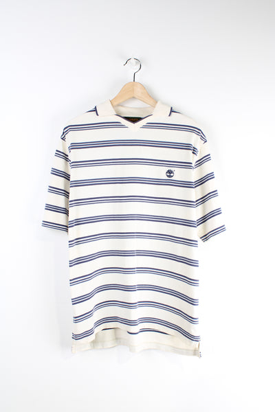 Timberland cream and blue striped polo shirt features signature embroidered logo on the chest