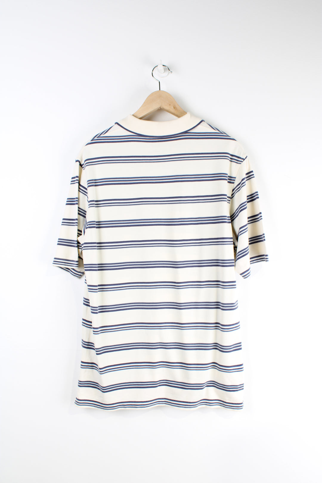 Timberland cream and blue striped polo shirt features signature embroidered logo on the chest