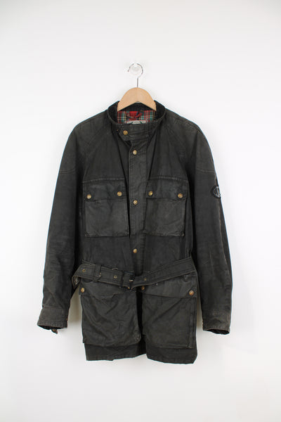 Vintage Belstaff black, zip through waxed jacket. Features plaid lining, belt and multiple pockets