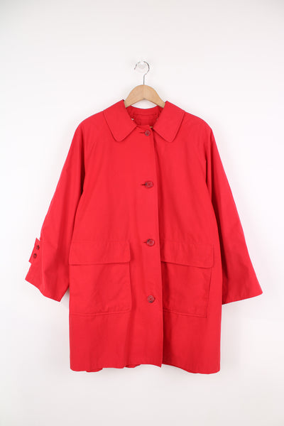 Vintage Burberry button up mac coat, in red. Features two large pockets and nova check details on the inside