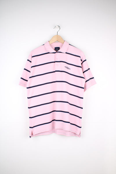 Umbro Polo Shirt in a pink and navy blue striped colourway, button up, short sleeved and has the logo embroidered on the front.