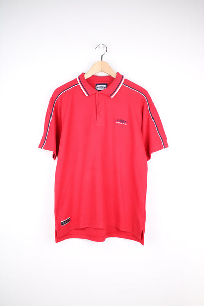 Umbro Polo Shirt in a red colourway with blue and white stripes going round the collar and shoulders, button up collar, short sleeved and has the logo embroidered on the front and back.