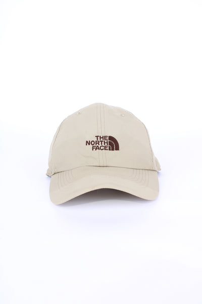 The North Face tan 100% Nylon cap, features brown embroidered logo across the front 