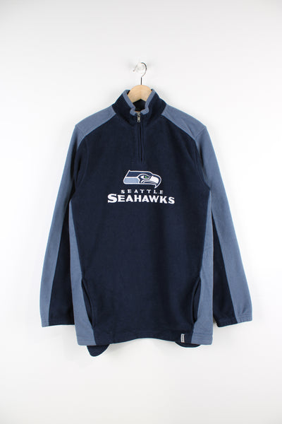 Vintage NFL Seattle Seahawks 1/4 zip pullover fleece by Reebok features embroidered spell-out across the chest