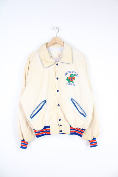 Vintage 1970s University of Florida 'Gators' cream corduroy varsity jacket by Delong Sportswear with embroidered badge and spell-out details