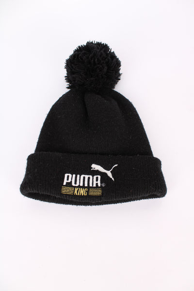 Puma King knitted black bobble hat, cuffed with embroidered logo on the front 