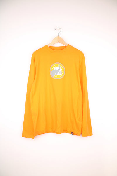 Nike ACG Long Sleeved T-Shirt in a orange and grey colourway, and has a elephant graphic design printed alongside the logo on the front and back.